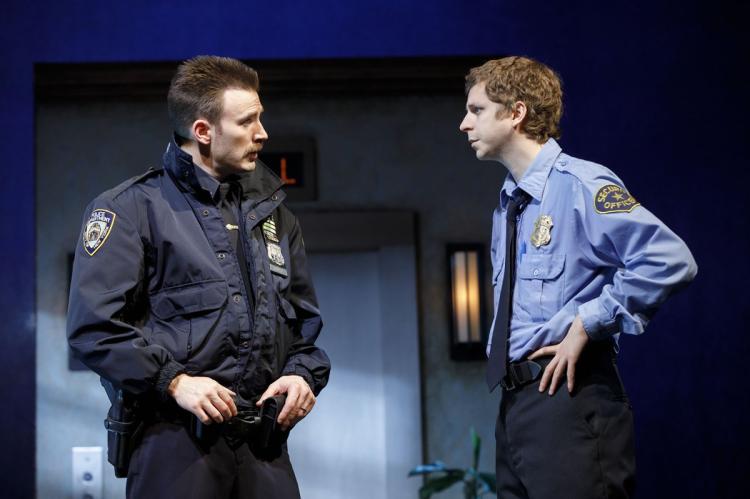 Bill (Chris), one of New York's not-so-finest, and Jeff (Michael Cera), a high-rise security guard, don't see eye-to-eye in "Lobby Hero."