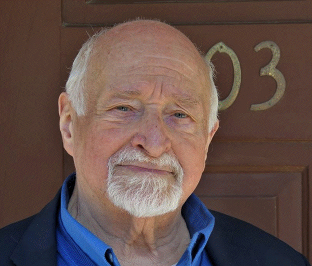 A person with a white beard
Description automatically generated with low confidence
