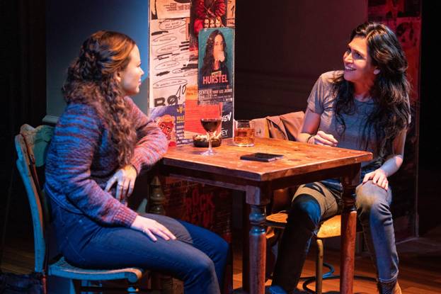 A couple of women sitting at a table

Description automatically generated with medium confidence