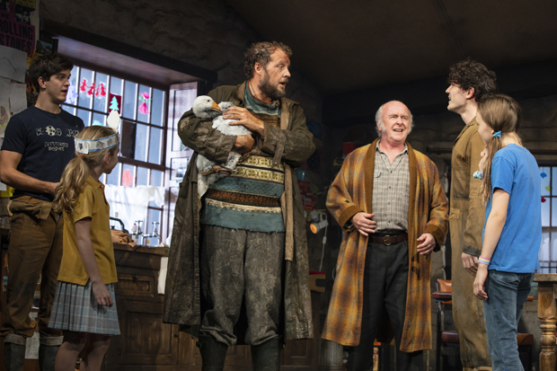 Justin Edwards and Peggy the Goose (center) in a scene from The Ferryman.