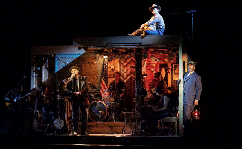 A group of people on a stage
Description automatically generated