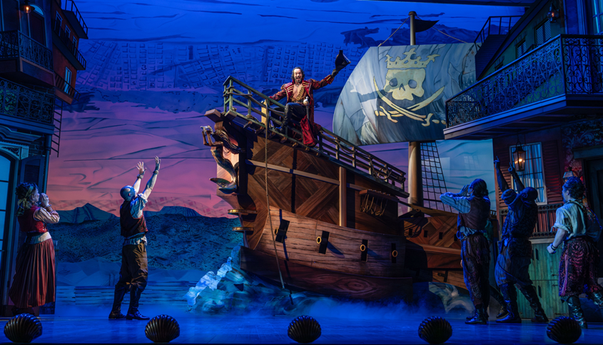 A scene from a musical play
Description automatically generated