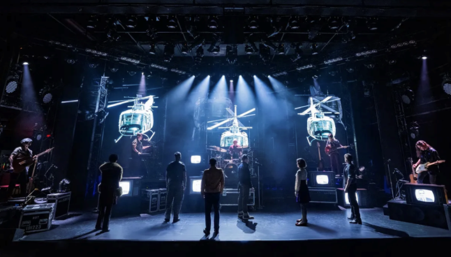 A group of people on a stage

Description automatically generated