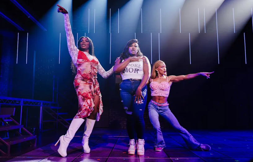 A group of women dancing on a stage

Description automatically generated