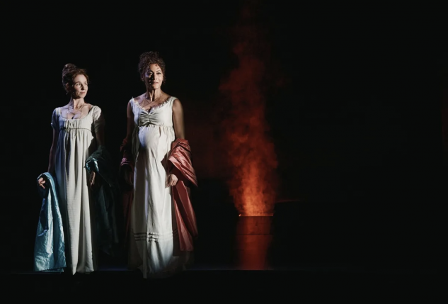 A couple of women in white dresses

Description automatically generated