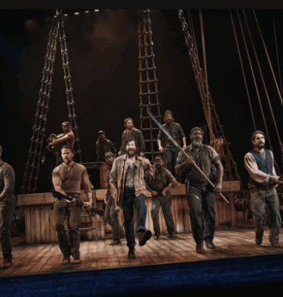 A group of men on a stage

Description automatically generated