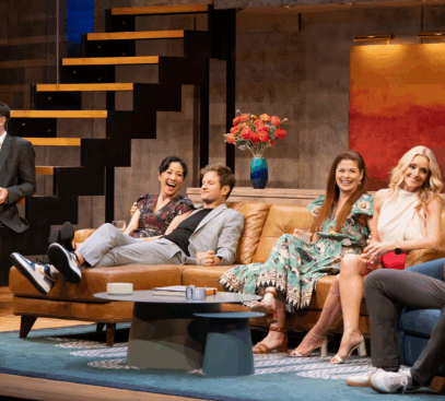A group of people sitting on a couch

Description automatically generated