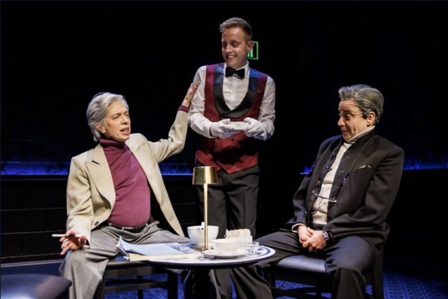 A group of men sitting at a table

Description automatically generated