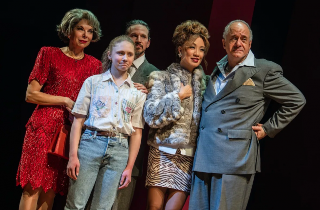 A group of people posing for a photo Description automatically generated