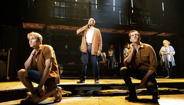 A group of men on stage

Description automatically generated