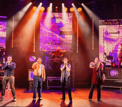 A group of people on a stage singing

Description automatically generated