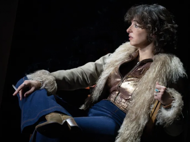 A person sitting in a chair

Description automatically generated