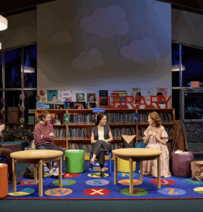 People sitting in a library

Description automatically generated