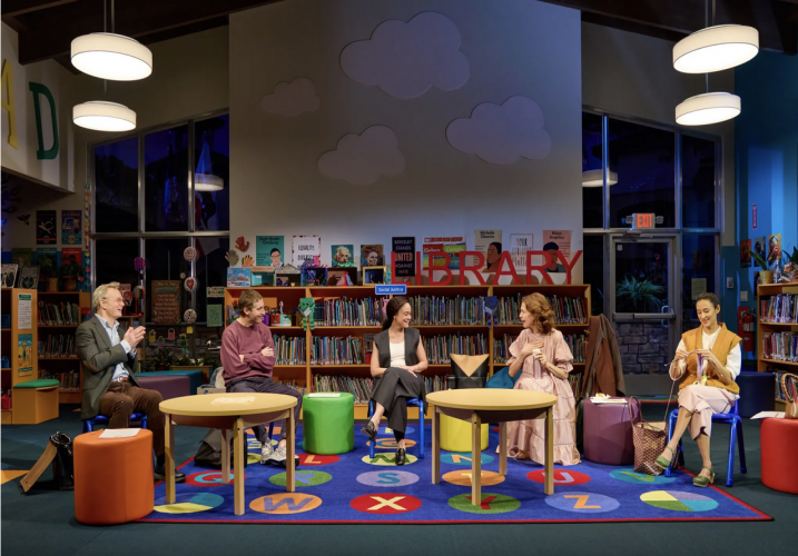 People sitting in a library
Description automatically generated