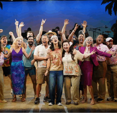 A group of people standing on a stage

Description automatically generated