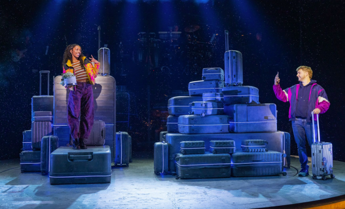 A group of people on a stage Description automatically generated