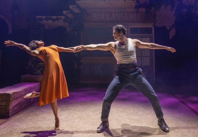 A person and person dancing on stage Description automatically generated