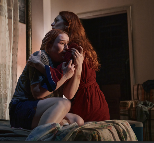 A person hugging another person

Description automatically generated