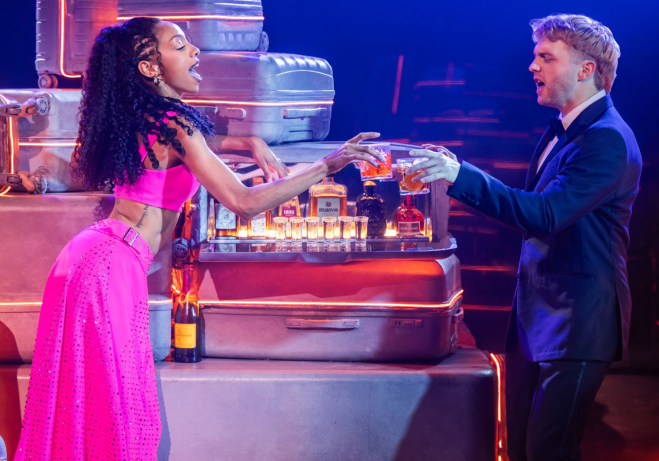 A person and person in a suit and tie Description automatically generated