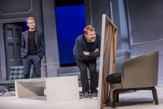 A person standing next to a mirror

Description automatically generated