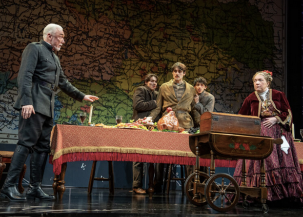 A group of people on a stage Description automatically generated