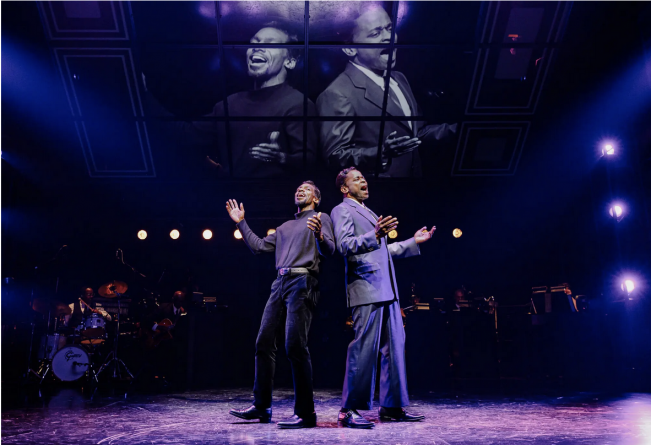 A group of men on a stage Description automatically generated