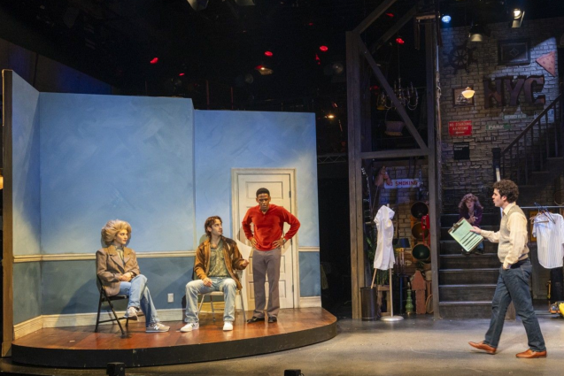 A group of people on a stage Description automatically generated