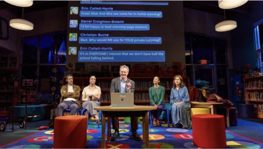 A group of people sitting in chairs and a person speaking to a person
Description automatically generated