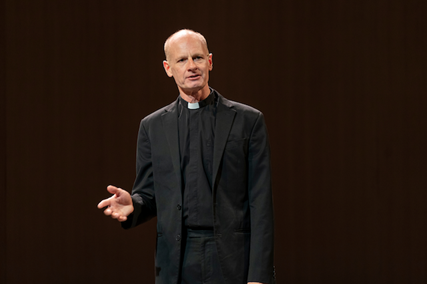 A person in a black suit
