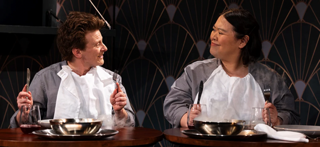 A person and person sitting at a table