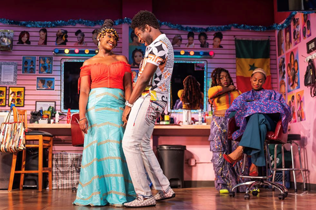A person and person dancing on a stage