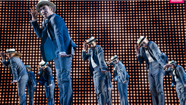 A group of men on a stage with medium confidence