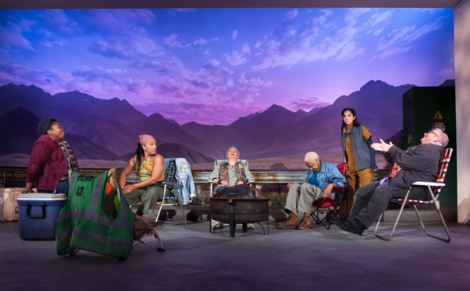 A group of people sitting around a fire pit