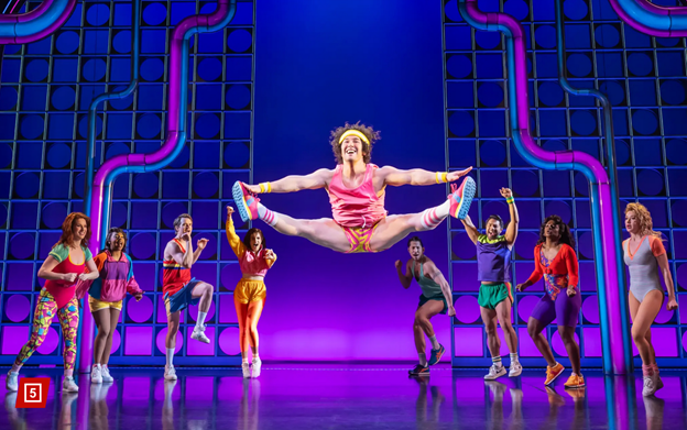 A group of people dancing on a stage