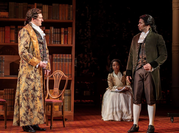 A person in a long robe and a person in a long robe