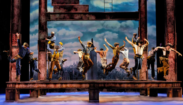 A group of people dancing on a stage with low confidence