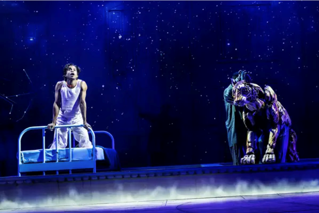 A picture containing screenshot, person, majorelle blue, gymnastics