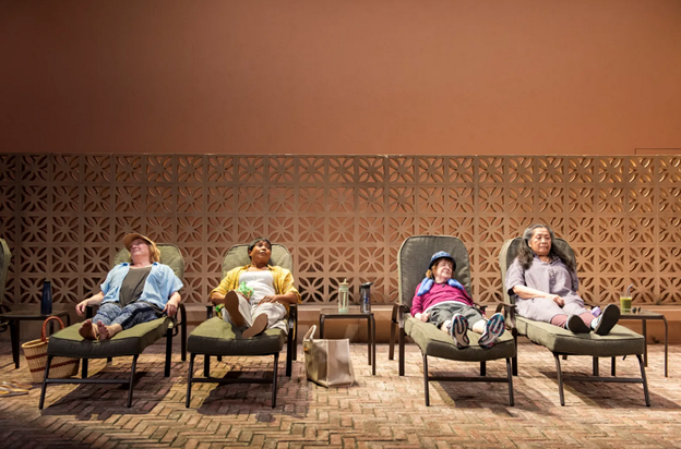 A group of people sitting in chairs