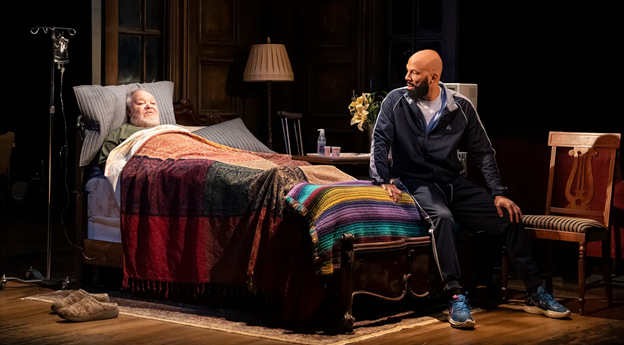 A person sitting on a couch next to a person lying in a bed with low confidence