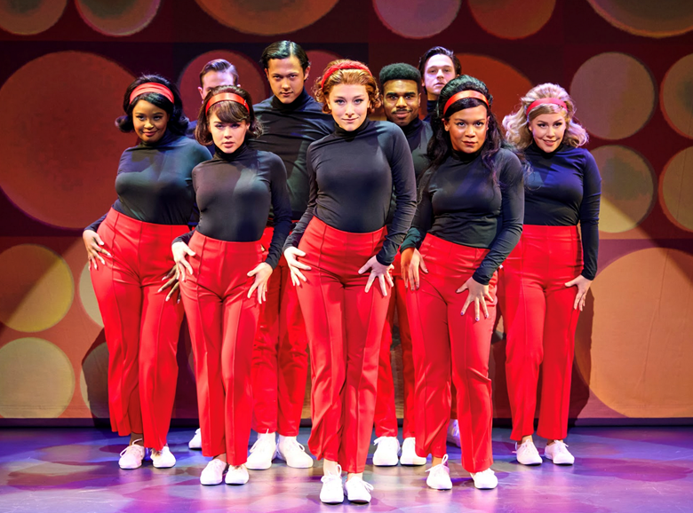 A group of people wearing red pants and black shirts