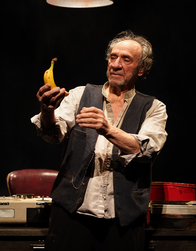 A person holding a banana
