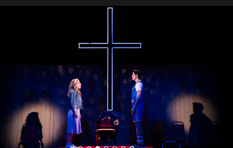 A person and person on a stage