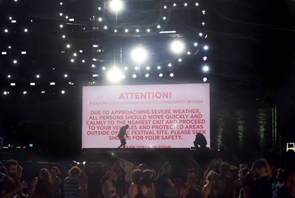 A picture containing text, crowd