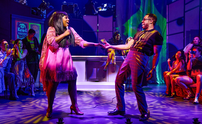 A person and person on a stage