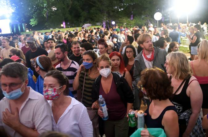 A group of people standing together with low confidence